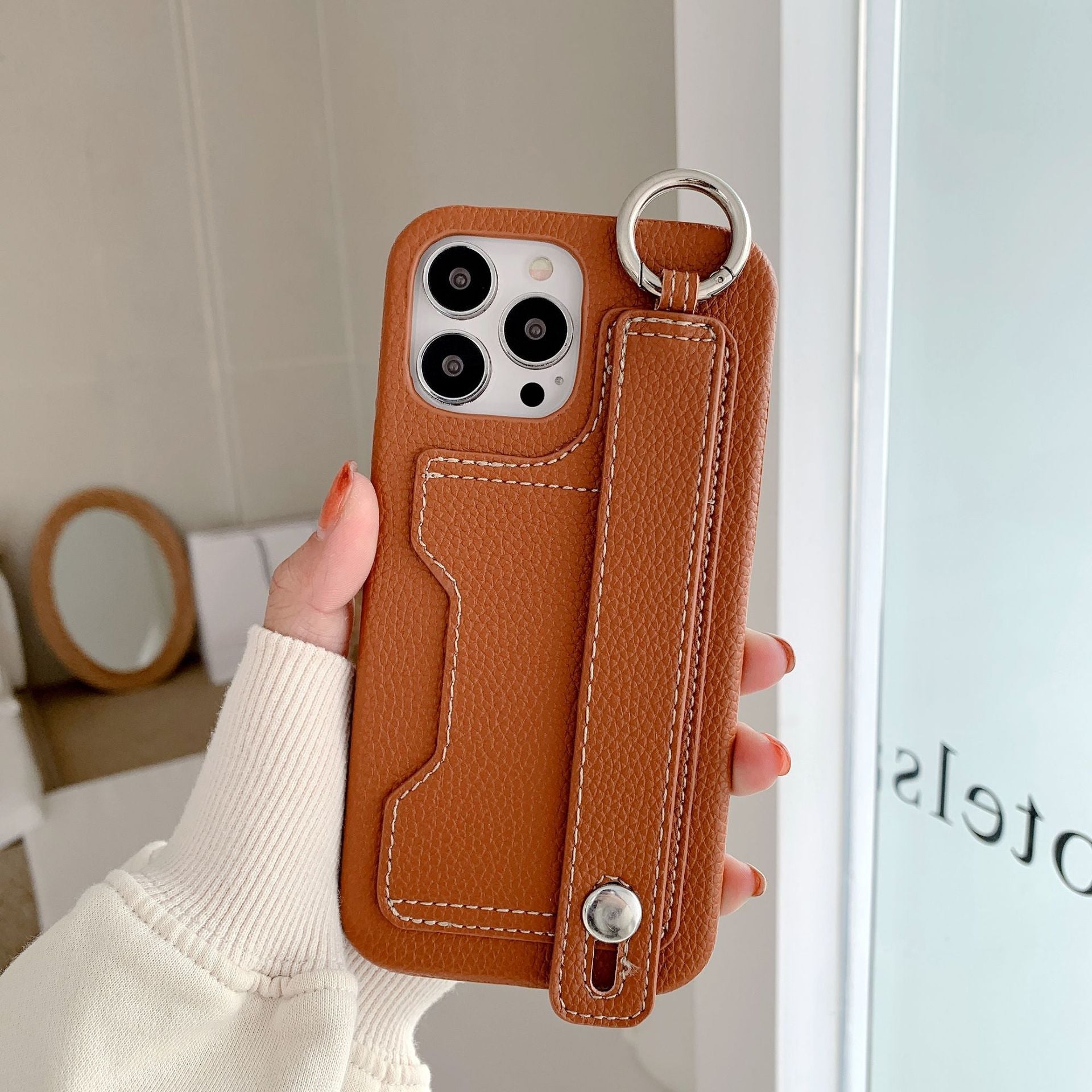 Leather phone case suitable for iPhone, with card slot and wrist strap protection