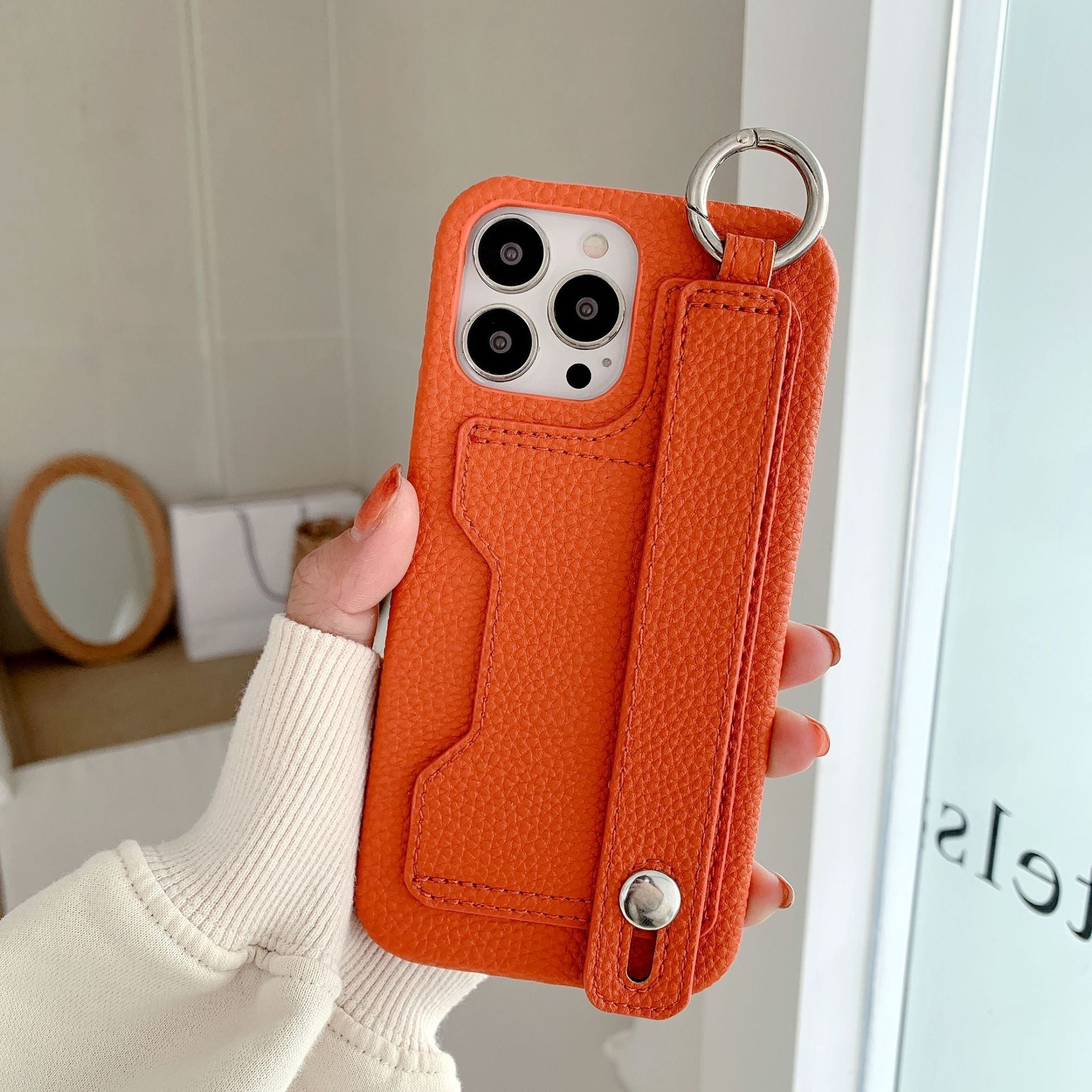 Leather phone case suitable for iPhone, with card slot and wrist strap protection